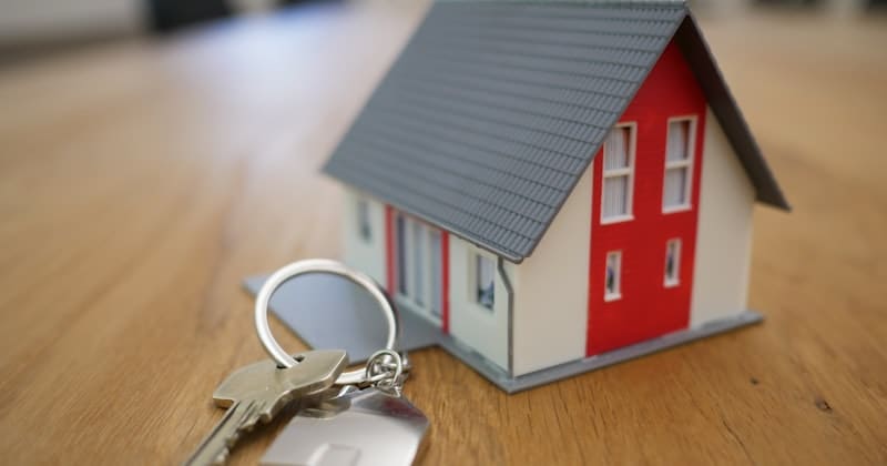 Model house with keys representing real estate development